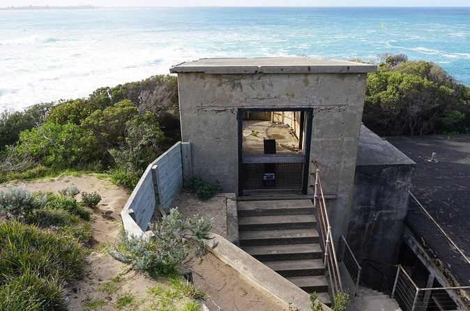 A concrete gun emplacement and its steps in the coastal scrub at Point Nepean
